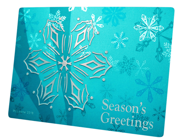 metal holiday card with contrasting gloss and embossed graphics