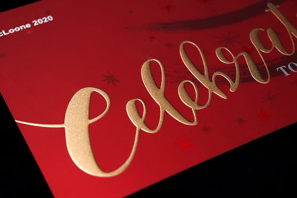 embossed graphics with metallic gold color on holiday card