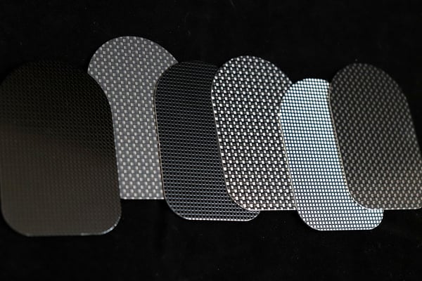 Carbon fiber finishes on metal surfaces reflect high performance and a sporty look for product identification