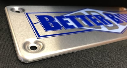 formed over edges on metal badges add height